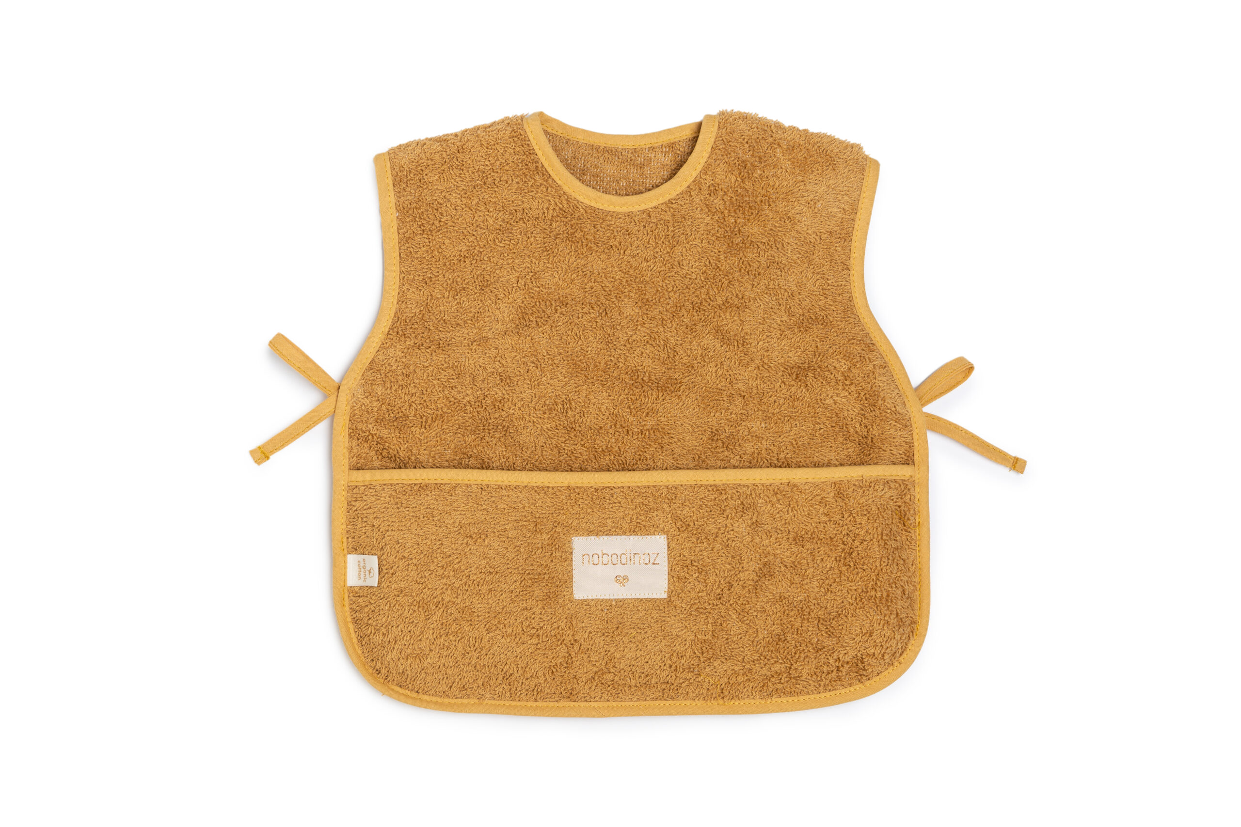bavoir éponge tablier sans manches couleur caramel pour les repas de bébé de la marque Nobodinoz chez Le béguin de Charlie