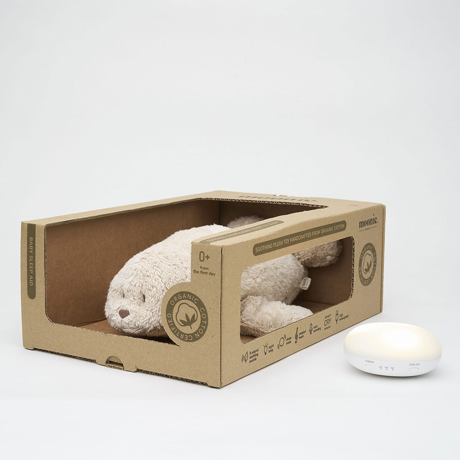moine phoque peluche sable - peluche avec veilleuse et bruits blancs - idée cadeau de naissance - pour endormir bébé - de la marque Moonie - disponible en ligne et en boutique chez Le béguin de Charlie à Tours
